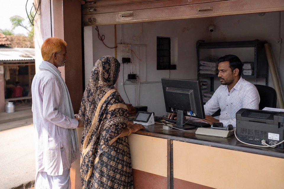 Bank CSP outlet serving customers at a local banking correspondent shop in India